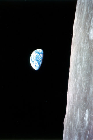  The planet earth in space with the moon in the foreground. 